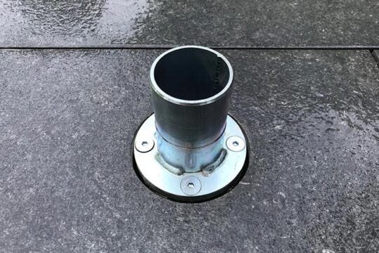Umbrella base in the ground.